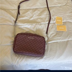 Medium.    Michael kors burgundy